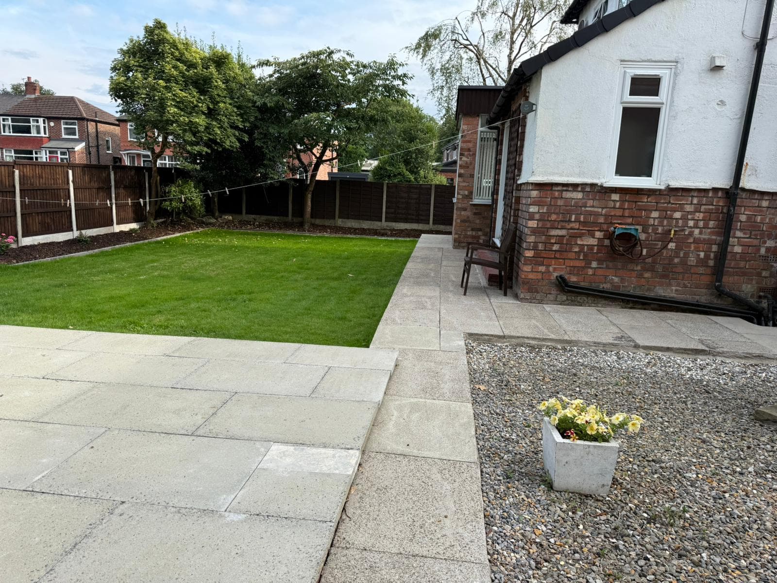 Stone flagging laid as a garden path beside a new lawn