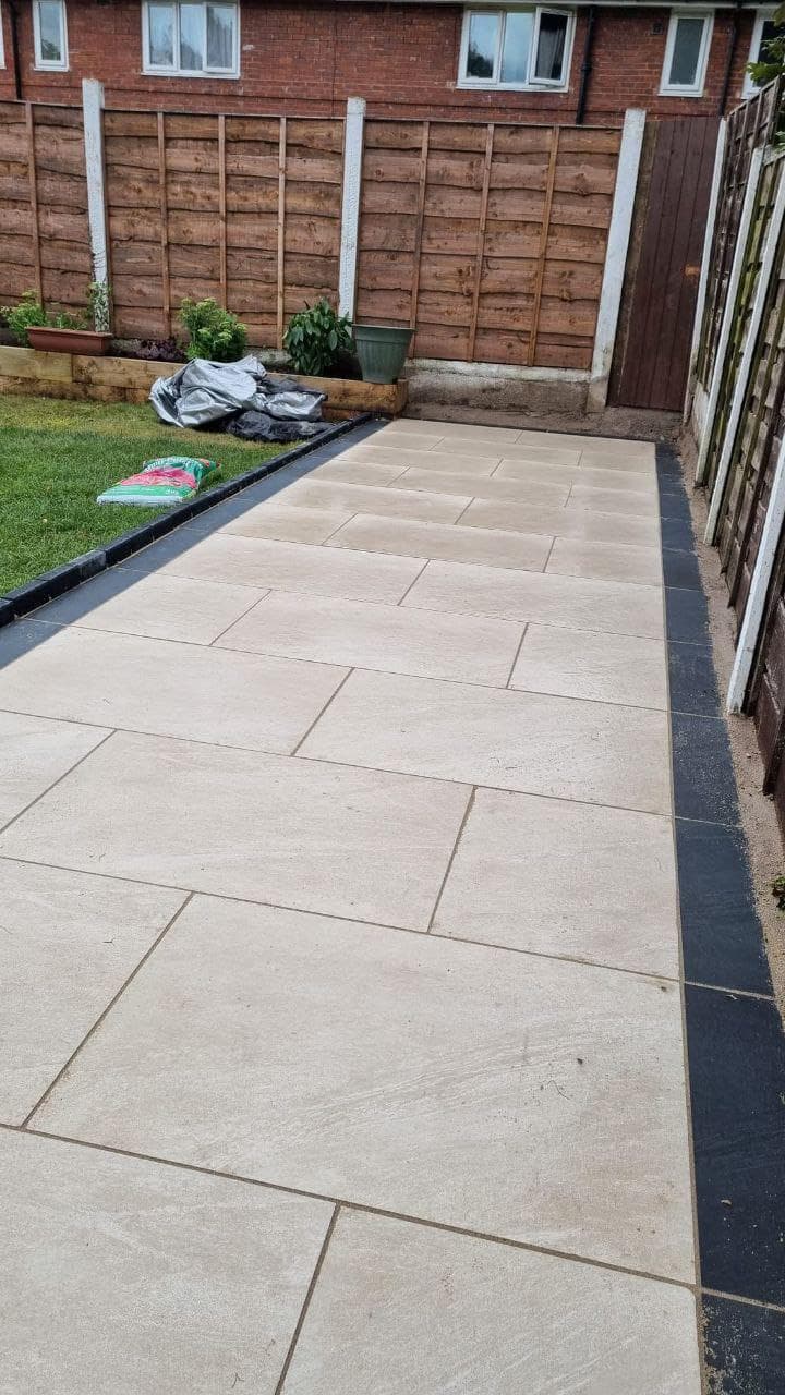 Large-format porcelain patio across the rear of a house