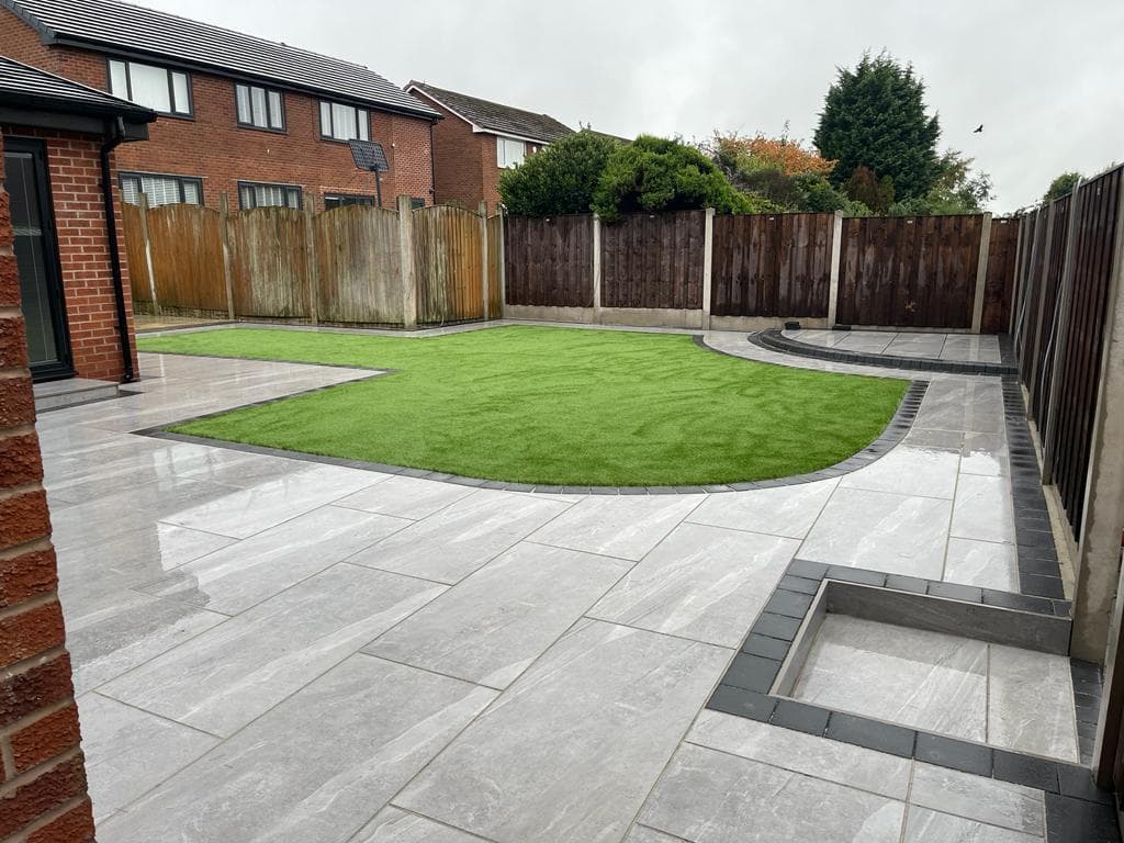 Marble-effect porcelain patio with a balustrade